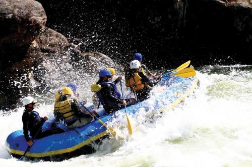 a group of people on a raft in the water at Holiday Inn Express Hotel & Suites Fraser Winter Park Area by IHG in Fraser