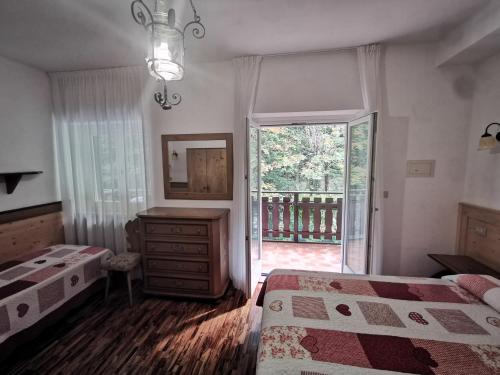 Ένα ή περισσότερα κρεβάτια σε δωμάτιο στο Lago Park Hotel
