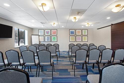 a room with rows of chairs in a classroom at Holiday Inn Express Exton - Great Valley by IHG in Exton