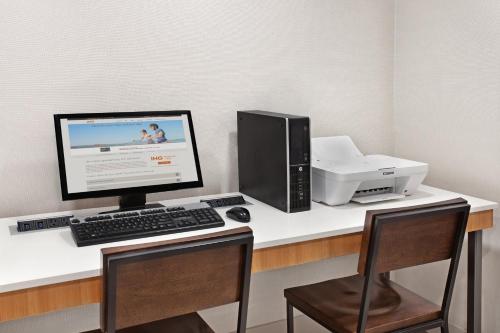 a desk with a computer and a printer on it at Holiday Inn Express Exton - Great Valley by IHG in Exton