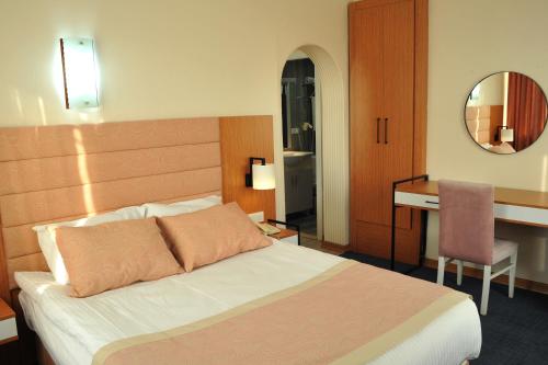 Letto o letti in una camera di Lion City Hotel Ankara