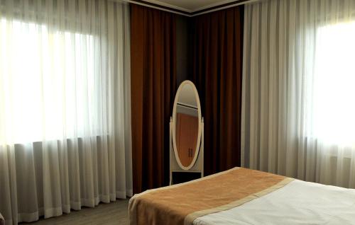 Letto o letti in una camera di Lion City Hotel Ankara