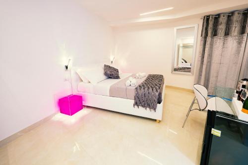 a bedroom with a bed and a tv in it at San Pietro Grand Suite in Rome