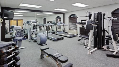 a gym with lots of treadmills and machines at Holiday Inn Express Hotel & Suites Dover by IHG in Dover