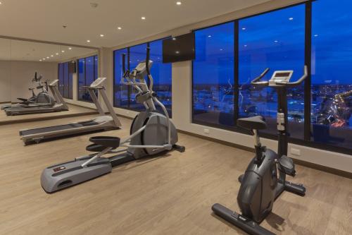 a gym with cardio machines and a view of the city at Holiday Inn Express Yopal by IHG in Yopal
