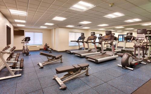 a gym with several treadmills and exercise machines at Holiday Inn Express El Paso I-10 East by IHG in El Paso