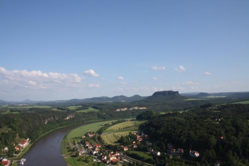 an aerial view of a river and a village at Hotel Indigo Dresden - Wettiner Platz by IHG in Dresden