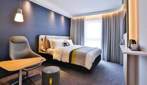 เตียงในห้องที่ Holiday Inn Express Karlsruhe - City Park, an IHG Hotel