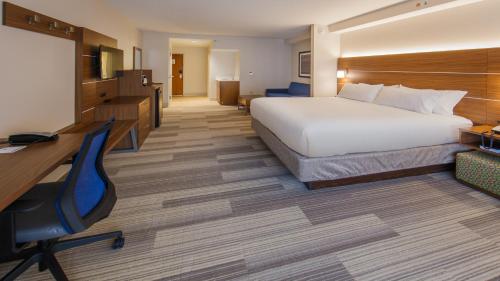a hotel room with a bed and a desk at Holiday Inn Express Gatlinburg Downtown by IHG in Gatlinburg