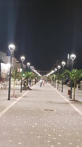 a street at night with a bunch of street lights at Sal Apartments Djadsal Moradias in Santa Maria