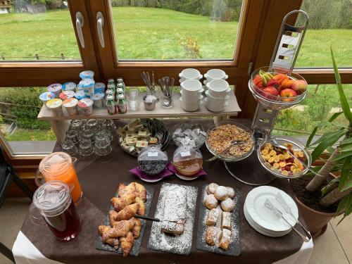 a table with many different types of food on it at Alpenblick Bed & Breakfast in Vipiteno