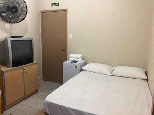 Voodi või voodid majutusasutuse Hotel Laçador toas