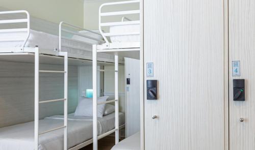 a couple of bunk beds in a room at Nyah - Adult Exclusive in Key West