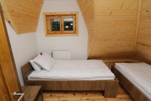 Vuode tai vuoteita majoituspaikassa Tara Cottage