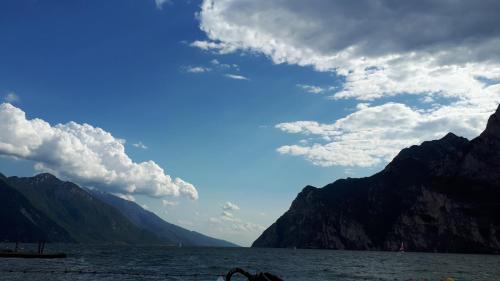 a view of a lake with mountains in the background at Magic Riva Apartment in Riva del Garda
