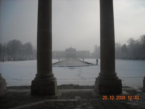 a view of a building from between two columns at Ahr Hotel Villa Alighieri in Stra