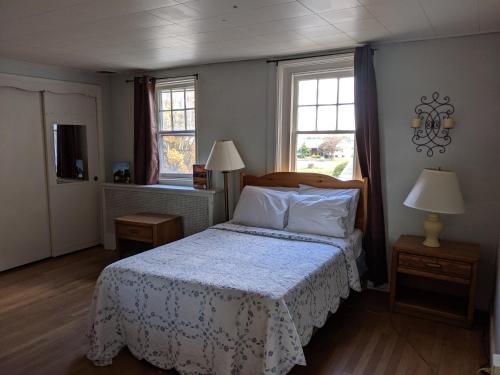 Ένα ή περισσότερα κρεβάτια σε δωμάτιο στο Spruce Lane Lodge and Cottages