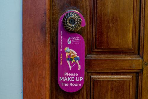 a sign on a door with a person on it at Poolside Villa in Phnom Penh