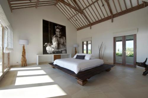 Un pat sau paturi într-o cameră la Villa Babar