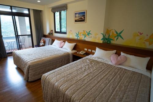 Un pat sau paturi într-o cameră la Herbal Life House B&B