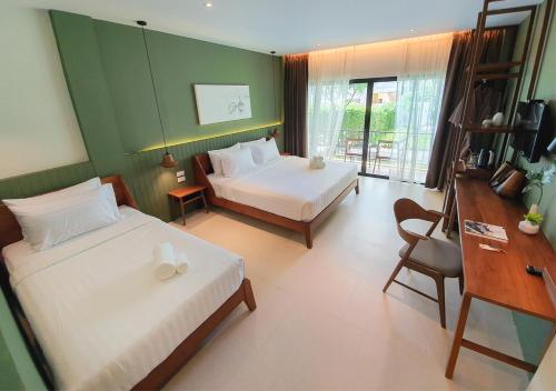 Postel nebo postele na pokoji v ubytování Mini House Aonang Hotel SHA Plus