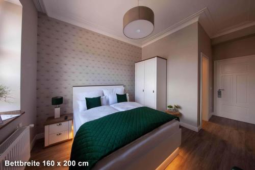 Ένα ή περισσότερα κρεβάτια σε δωμάτιο στο Hotel Altes Amtshaus