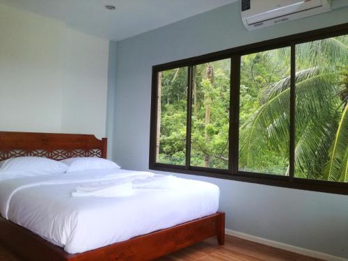 Postel nebo postele na pokoji v ubytování Koh Samui Palm View Villa