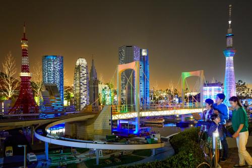 a city skyline at night with tall buildings at LEGOLAND Japan Hotel in Nagoya