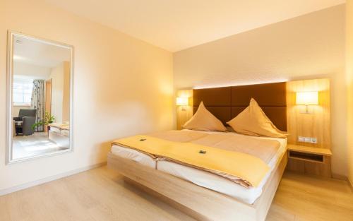 Ένα ή περισσότερα κρεβάτια σε δωμάτιο στο Hotel Grasberger Hof GmbH