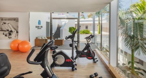 a gym with two exercise bikes in a room at Flamingo Beach Mate in Adeje