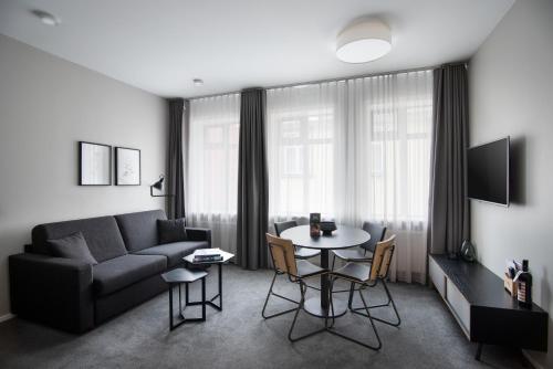 a living room with a couch and a table at Reykjavik Residence Apartment Hotel in Reykjavík