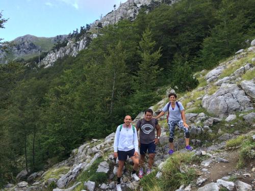 three people standing on a mountain trail at Casa Vacanze del Pollino in Fardella