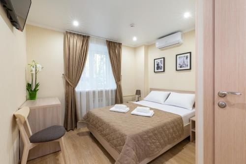 Ένα ή περισσότερα κρεβάτια σε δωμάτιο στο Mini-hotel Khamovniki