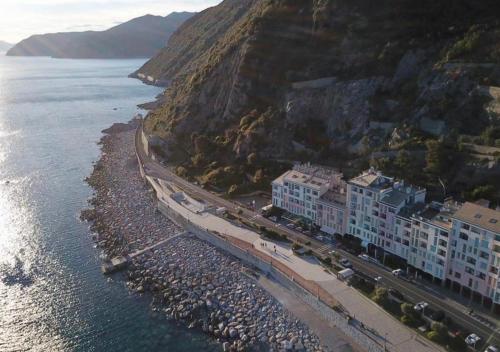 an aerial view of a beach with buildings and the water at Camera Olimpia in Deiva Marina