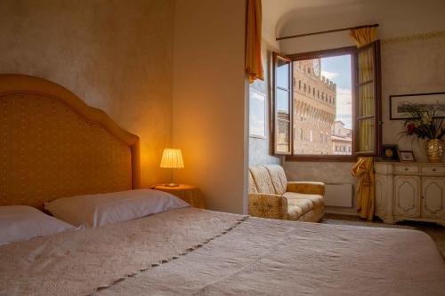 Säng eller sängar i ett rum på Magic Signoria Apartment