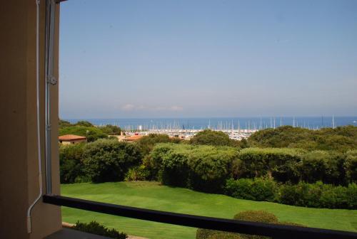 a view of the ocean from a window at Due balconi sul mare in Punta Ala
