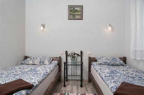 מיטה או מיטות בחדר ב-Smėlio Apartamentai