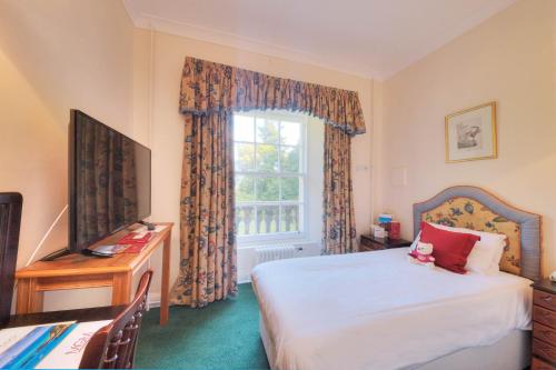 a hotel room with a bed and a window at Muthu Newton Hotel (Near Inverness Airport) in Nairn