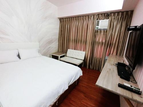 En eller flere senge i et værelse på Feng Chia Hygge