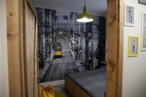 a hallway with a wall mural of a city at Dundee's Point in Szentendre