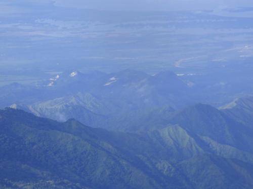 a view of a mountain range from an airplane at Hostal Alto de la Montaña in Minca