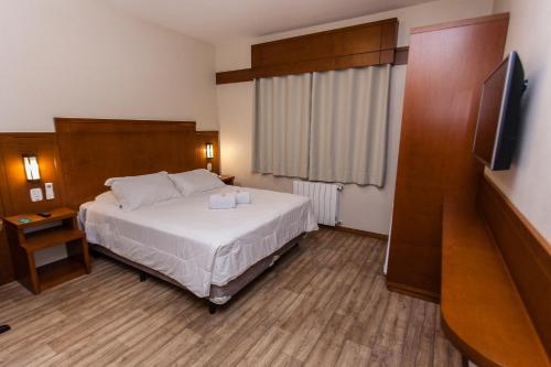 Katil atau katil-katil dalam bilik di Tri Hotel Lago Gramado