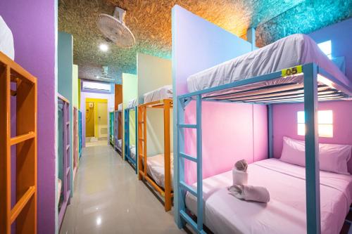 a group of bunk beds in a room at myPatong Social Hostel in Patong Beach