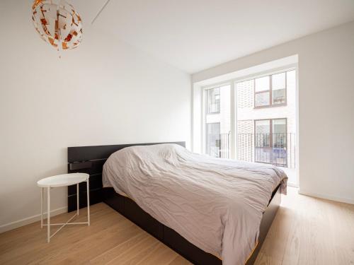 En eller flere senge i et værelse på 3 Bedroom Apartment on the new Nordhavn canals neighborhood