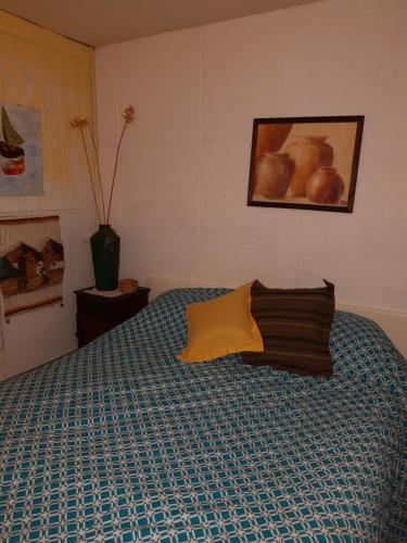 Un ou plusieurs lits dans un hébergement de l'établissement Los Carolinos Departamentos