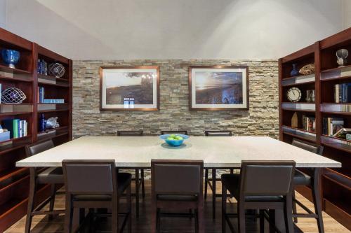 a dining room with a large table and chairs at Holiday Inn Express & Suites Carpinteria by IHG in Carpinteria