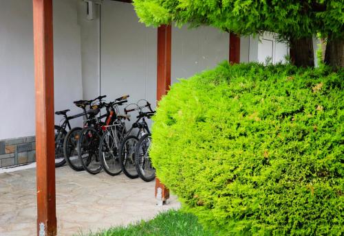 a group of bikes parked next to a building at Renaissance Holidays Villa in Nea Kalikratia