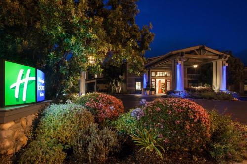 a sign in front of a building at night at Holiday Inn Express & Suites Carpinteria by IHG in Carpinteria