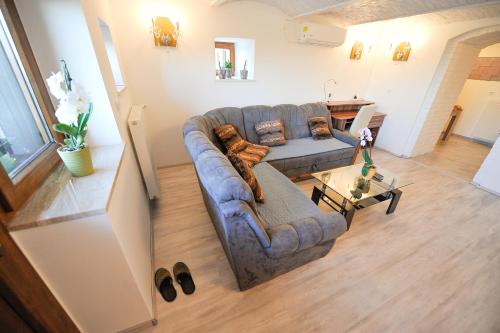 a living room with a couch and a table at Apartments Jernej with Onsite Wellness in Brežice