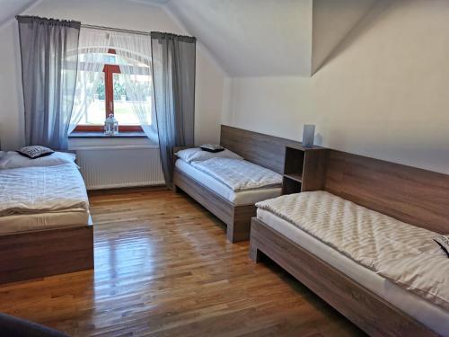 Postel nebo postele na pokoji v ubytování Zamoček